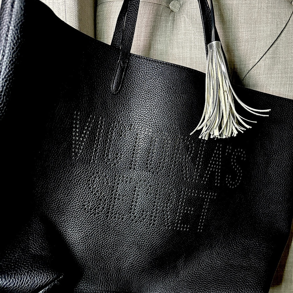 Black Victoria's Secret tote bag with leather tassel and hole embroidery